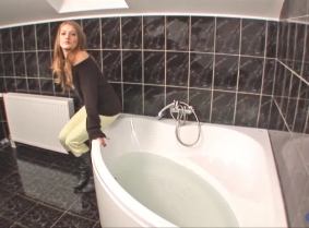 Here is another bathtub update for the sweater fans... Angela was kind enough to soak another outfit of hers for our viewing pleasure. In this update she wears light green pants, a black sweater without a bra underneath and matching leather boots.