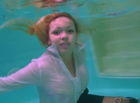 Mira look fabulous fully clothed underwater.
Enjoy watching her playing and posing for the camera.