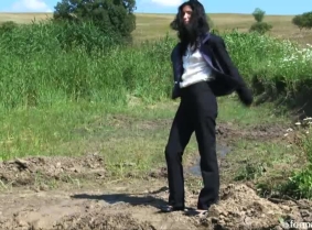 Christine is trashing a fine business suit into the mud. Watch her covering her clothes and heels completely with thick mud.
Wash off session included.