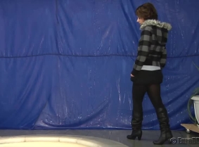 Rita is getting dunked in the pool while she is wearing one of her winter outfits. During the clip she removes the jacket and the sweater and even her boots.