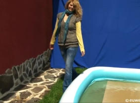 Missy's casual clothes are looking really nice once she got them wet into the kiddy pool. She is wearing a pair of yellow ballet flats and nylon socks.