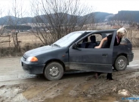 Judith was returning home from her girlfriend's place and her car broke down right in the middle of a muddy road. Of course, as you can imagine, Judith had to look under the hood to see what was wrong, but that made her mess her satin pants and heels with
