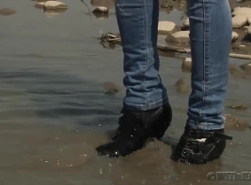 Adria's skin tight jeans are looking great... especially when they are soaked in the river.