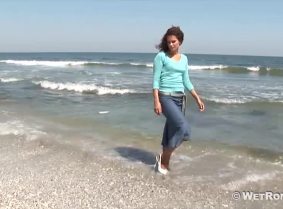 Denim skirt and casual blouse, tan pantyhose and high heeled shoes... That's Adina's outfit for today's swim.