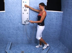 Maya is taking a shower in her gym outfit. The only extra is the sheer pantyhose she is wearing under the capri white leggings. 
Watch her enjoying herself while her clothes wet and tight on her body are clinging under the water spray.